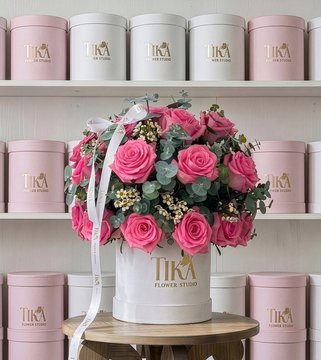 “Charm Pink” roses and eucalyptus box bouquet