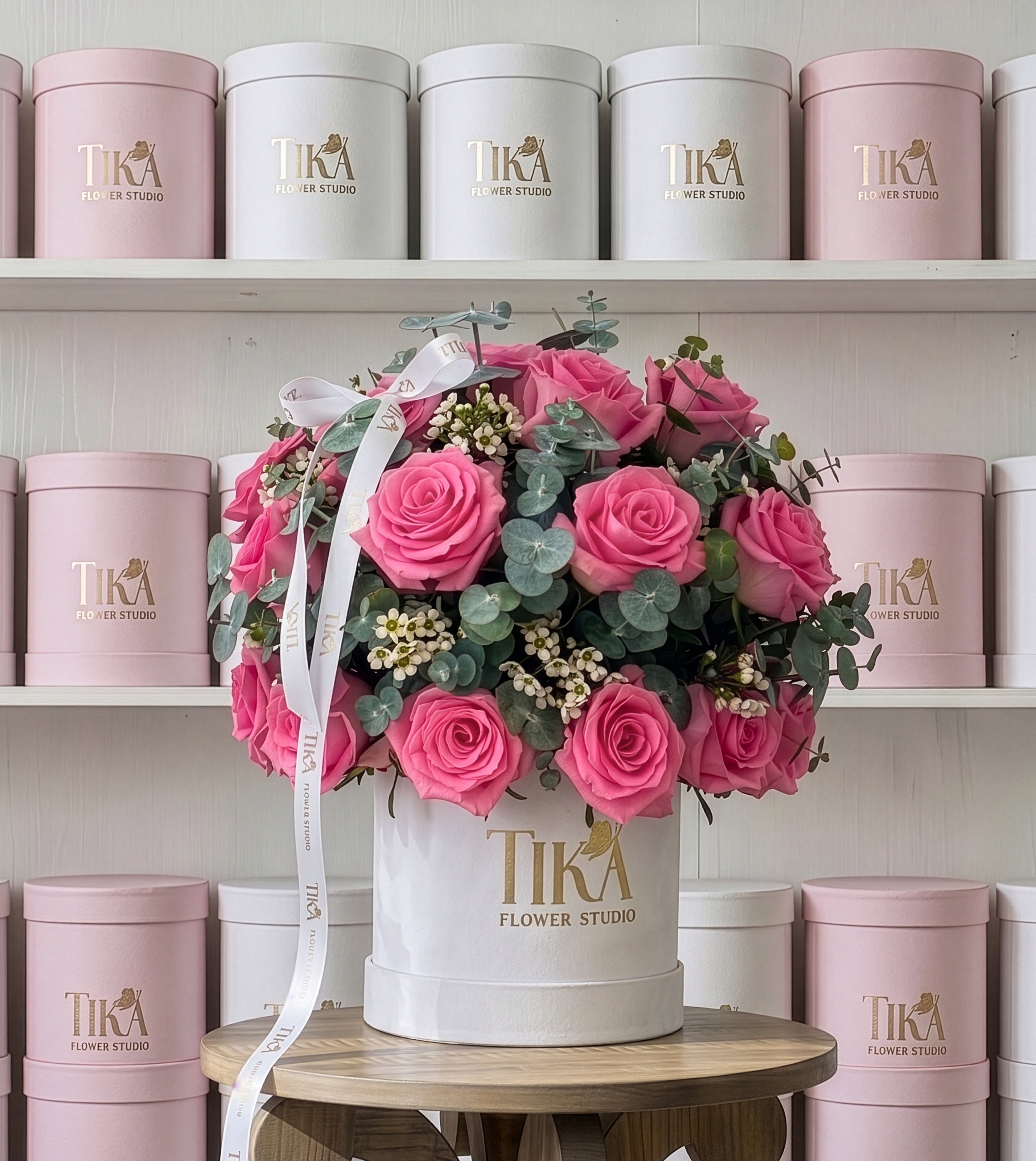 “Charm Pink” roses and eucalyptus box bouquet