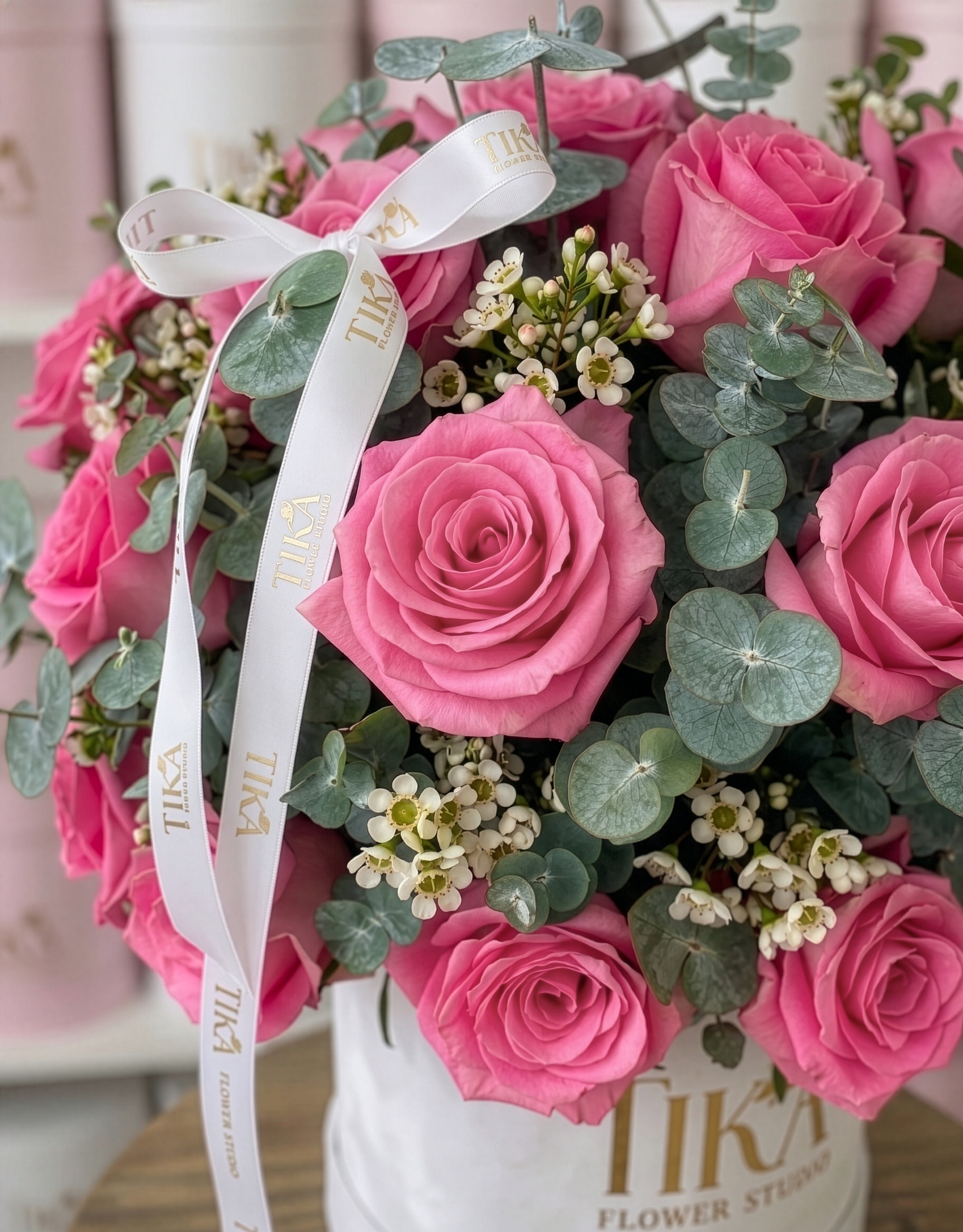 “Charm Pink” roses and eucalyptus box bouquet